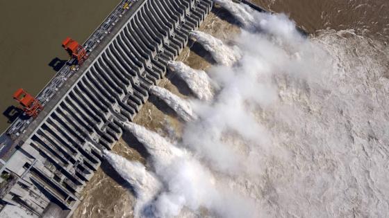 YICHANG -- Aerial photo taken on Aug. 2, 2020 shows water gushing out from the Three Gorges Dam in central China's Hubei Province. According to the Changjiang Water Resources Commission of the Ministry of Water Resources, reservoirs along the upper and middle reaches of Yangtze River, including the Three Gorges Dam and the Gezhou Dam, have held back over 30 billion cubic meters of floodwater since July this year. (Photo by Du Huaju/Xinhua via Getty) (Xinhua/Du Huaju via Getty Images)