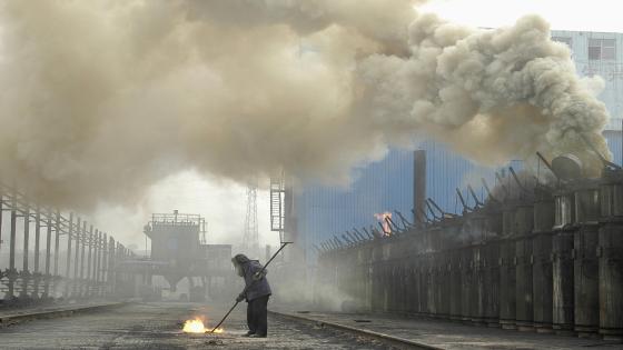A labourer works at a coking plant in Changzhi, north China's Shanxi province, July 7, 2007. Starting off in Sydney on Saturday and travelling west around the world, the Live Earth concerts, planned for this weekend, are expected to attract more than a million people to raise awareness of global warming and environmental issues like climate change. REUTERS/Stringer (CHINA) CHINA OUT - RTR1RJUT