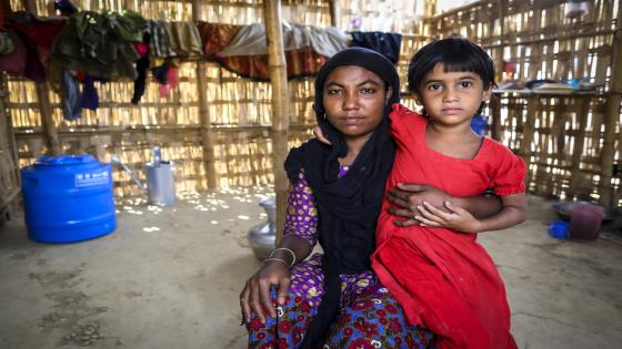 23 March 2018, Kutupalong Camp, Cox's Bazar, Bangladesh - Nur Bahar, 22, standing with her daughter. 
FAO Project OSRO/BGD/704/IOM. Emergency Nutrition and Food Security Intervention for People Affected by the Refugee Crisis in Cox`s Bazar.