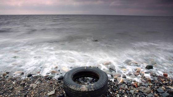 PRESTWICK, SCOTLAND - MARCH 22: A tyres is washed up by the sea on the beaches in Prestwick, Scotland, 22 March 2005. A survey conducted by Beachwatch in September of last year, monitored 46 beaches in Scotland and a total of 250 in the UK. The main source of litter (33.4%) was from beach visitors. This was followed by sewage-related debris (26.1%), fishing debris (9.9%) and shipping (2.3%). (Photo by Christopher Furlong/Getty Images)