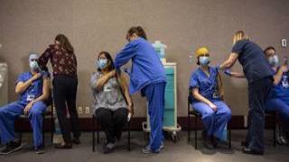 PORTLAND, OR - DECEMBER 16 : Healthcare workers get the Pfizer-BioNTech COVID-19 vaccination at the Legacy Emanuel Medical Center on December 16, 2020 in Portland, Oregon. Today was the first day of vaccinations in Oregon. (Photo by Paula Bronstein/Getty Images)